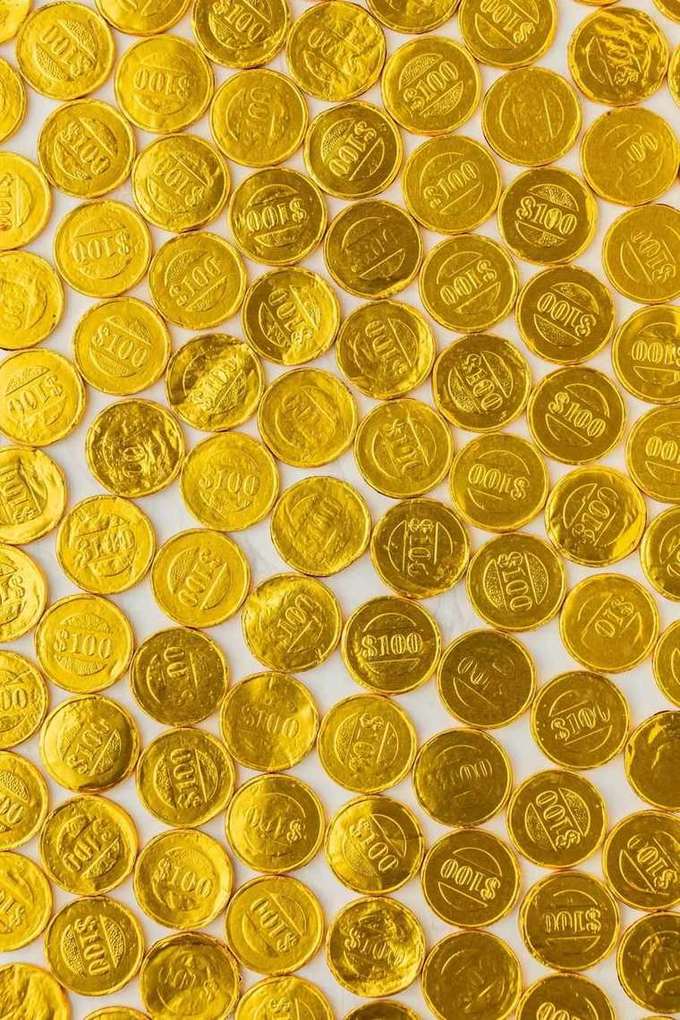 Tumpukan koin emas melambangkan bonus selamat datang
